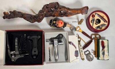 a box of wine tools and a bottle opener on a table