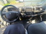 a dashboard of a truck with a steering wheel and dashboard controls