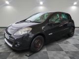 a picture of a small black car parked in a garage