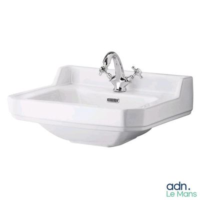a white bathroom sink with a chrome faucet and a chrome faucet