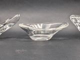 three clear glass vases sitting on top of a table