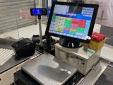 an image of a cash register machine in a store