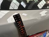 a ruler on the back of a car that is parked