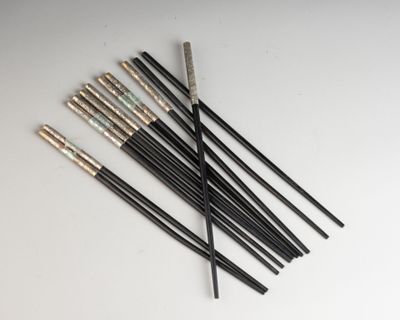 a set of six black and gold arrows on a white surface