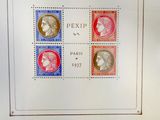 une image représentant une photo d'un timbre sur lequel figurent quatre visages différents