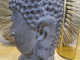 a statue of a head with a spiky head on top of it