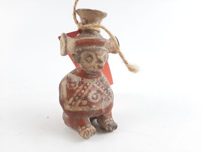 a figurine of a dog with a hat on it