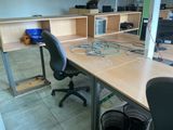a desk with a chair and a computer on it