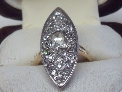 an image of a diamond ring is displayed in a ring holder