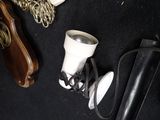 a pair of shoes and a cup on the floor