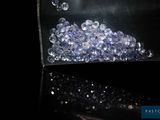 a clear bag filled with blue and white beads