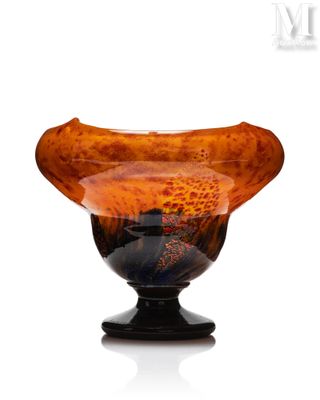 a glass vase that is sitting on top of a table