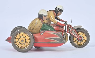 a figurine of a man riding a motorcycle with a dog on the back