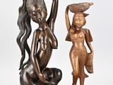 pair of bronze figurines of a woman with a basket on her head and a woman with a basket on her head
