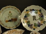 a lot of plates and bowls that are sitting on a table