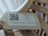 a label on a chair that is sitting on a table
