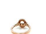 an image of a gold ring with a flower
