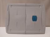 a plastic container that has a blue patch on it