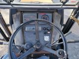 a close up of the steering wheel and dashboard of a tractor