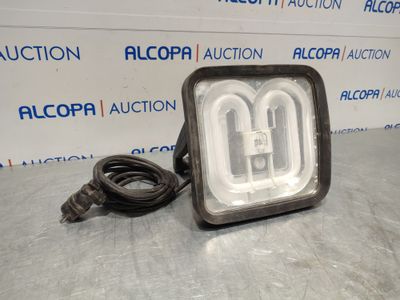 a close up of a light on a table with a cord