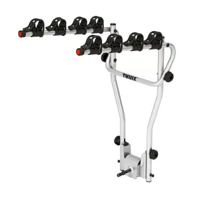 a close up of a bike rack with four bicycles on it