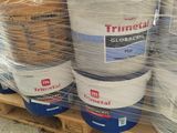 several buckets of paint are wrapped in plastic on a pallet