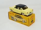 a yellow toy car sitting on top of a yellow box