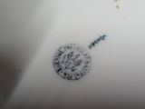 a white plate with a black and white design on it