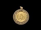 a close up of a gold coin on a black background