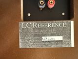 an image of a close up of a metal object with a name tag attached to it
