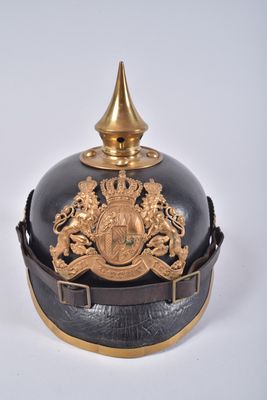 a black and gold helmet with a gold crown on it