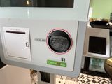 a machine that is sitting on the counter in the kitchen