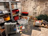 a room with a radiator, a radiator, and other items in it