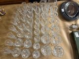 a lot of empty wine glasses on a table