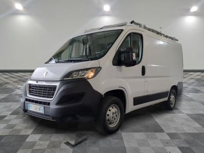 the white van is parked on a checkered tile floor