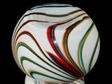 a glass ball that is sitting on top of a table