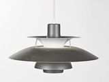 a close up of a black and white lamp hanging from a ceiling