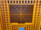 a yellow crate that has a blue label on it