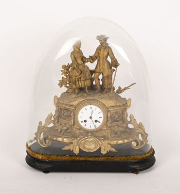 a glass dome with a gold clock inside of it