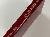 a red book sitting on top of a white table