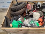 a wooden box filled with assorted items and tools