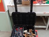 a tool box with tools in it sitting on the floor