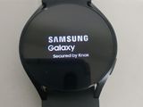 the samsung smart watch is displayed on a white surface with a black band