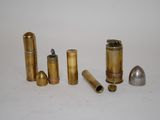 several different types of bullet shells on a white surface