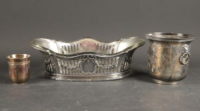 three pieces of silverware are sitting on a table next to each other