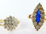 two rings, one with a blue stone and the other with diamonds