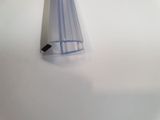 a clear plastic tube with a black handle on a white surface