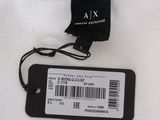 a close up of a white shirt with a tag on it