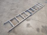 a ladder that is laying on the ground on the ground