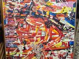 une peinture abstraite représentant une peinture abstraite rouge et jaune, montée sur un châssis en bois